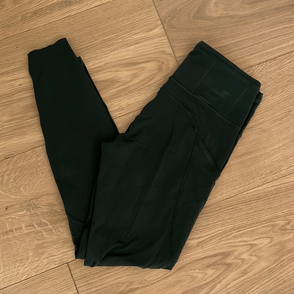 Lululemon Hunter Green leggings with pockets on the sides for your phone!